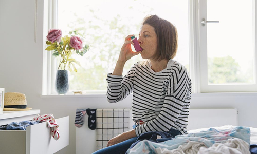 Woman with Asthma Inhaler.jpg