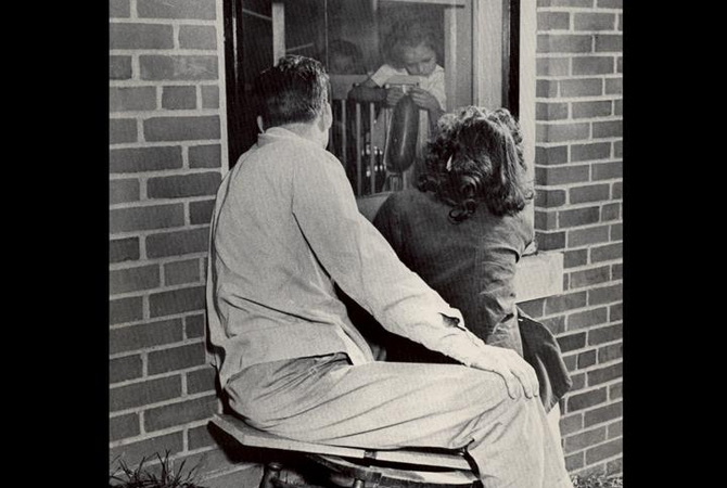 Man and woman looking in window.jpg