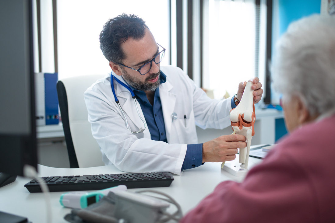 Orthopedic surgeon talking to patient.jpg