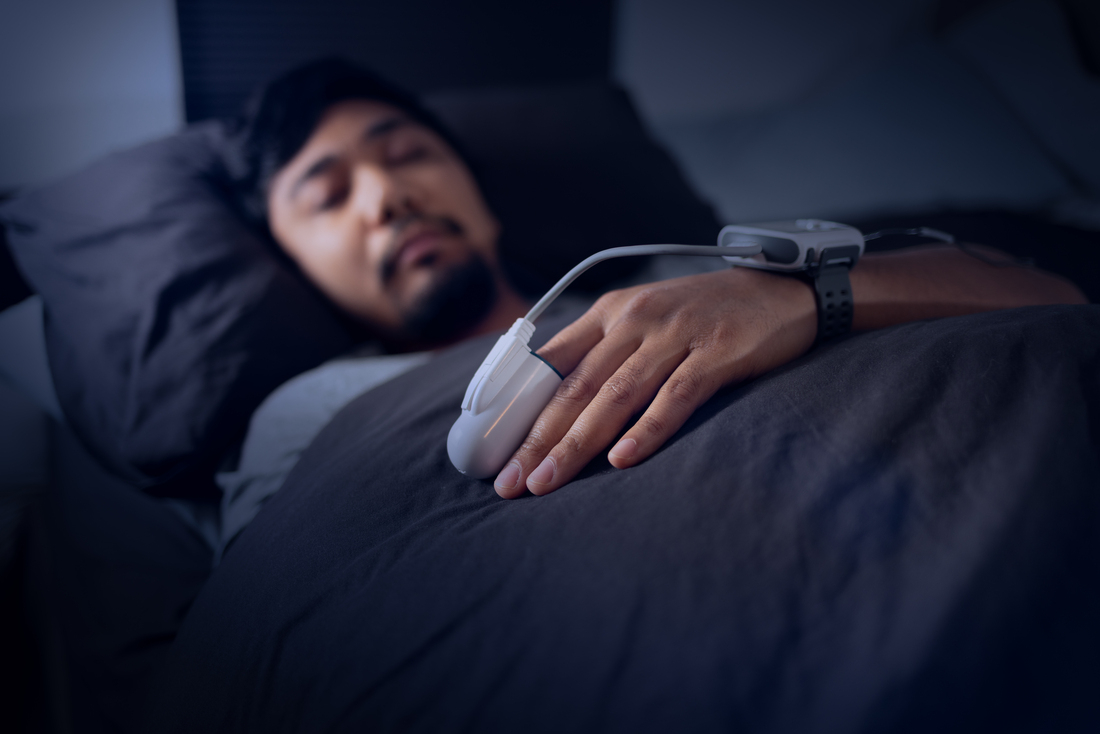 Man Wearing a Pulse Oximeter - At Home Sleep Study Test for Sleep Apnea.jpg