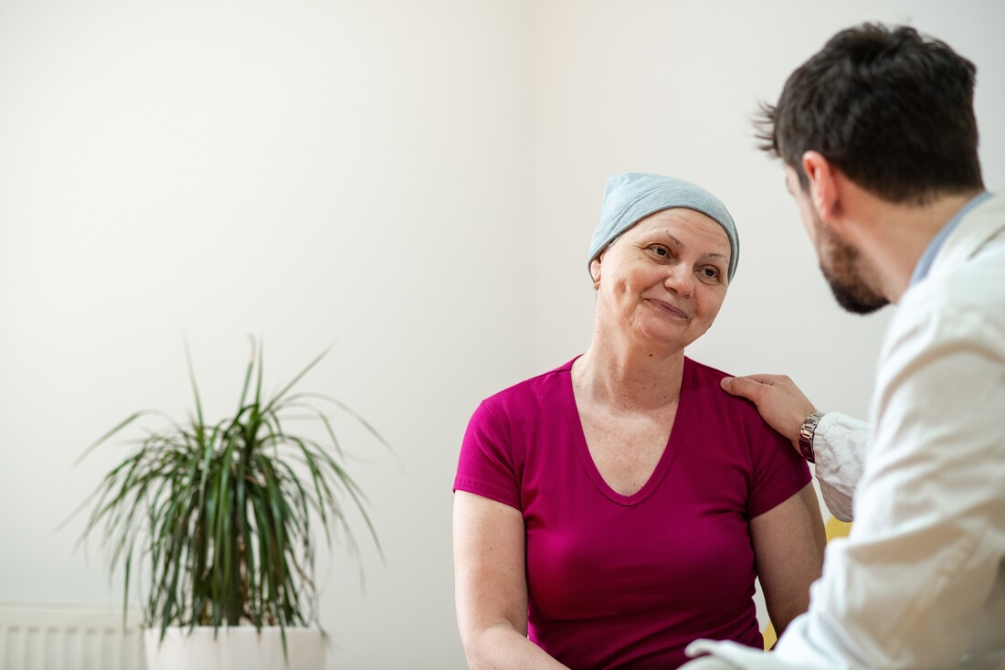 Oncology navigator talking with patient