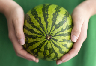 Woman holding mini watermelon - week 39.jpg