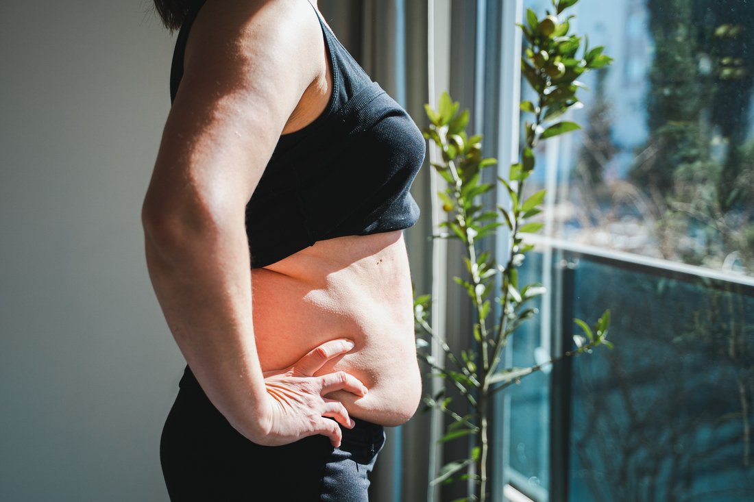Woman stomach with loose skin.jpg