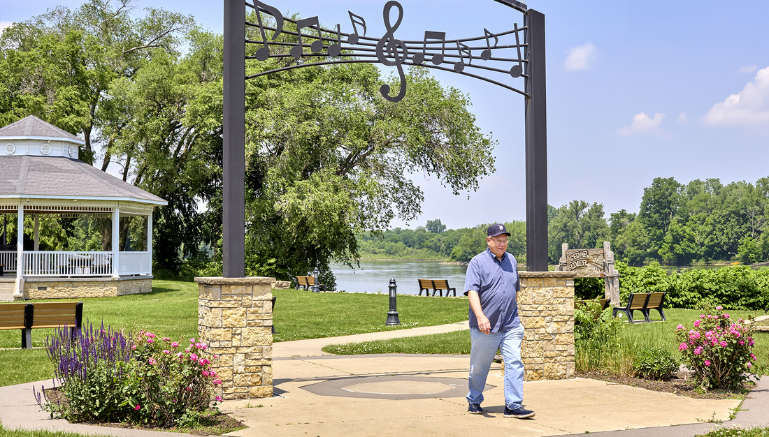 Bill Keller walking outside at a park.jpg