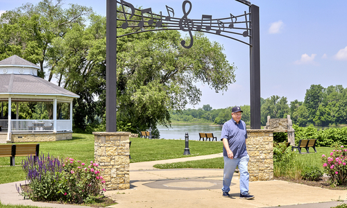 Bill Keller walking outside at a park.jpg