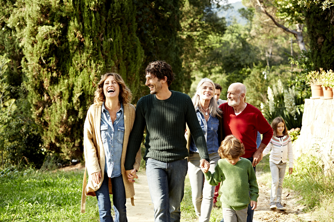 Happy multi-generation family taking a walk outdoors.jpg