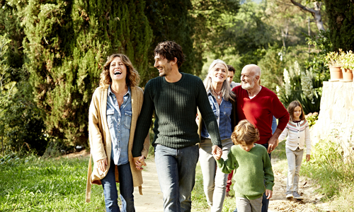 Happy multi-generation family taking a walk outdoors.jpg
