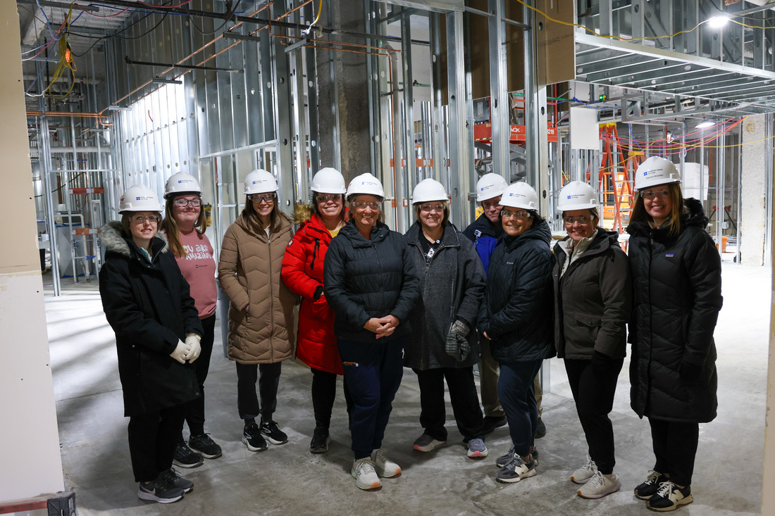 Team members and donors taking a photo inside Fort Dodge surgery renovation and expansion space