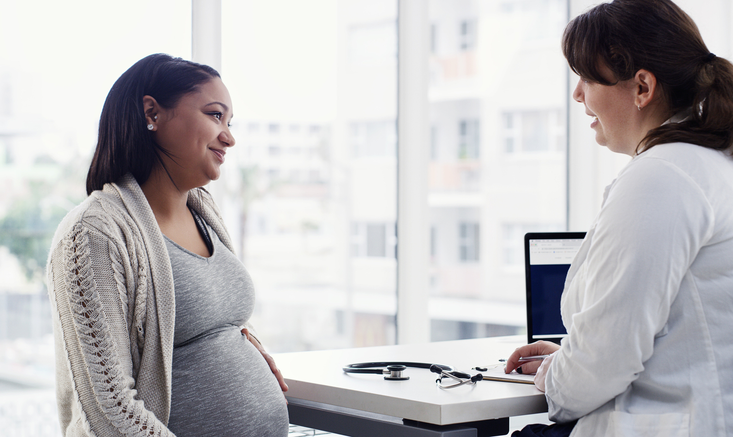Pregnant woman talking with doctor.jpg