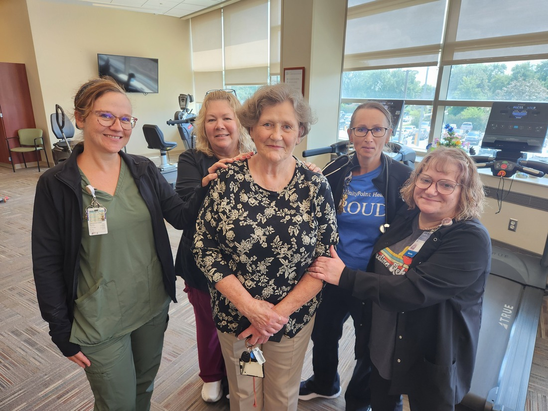 Sandra Wright standing with healthcare team.jpg