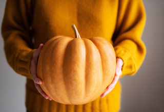 Woman holding small pumpking - week 40.jpg