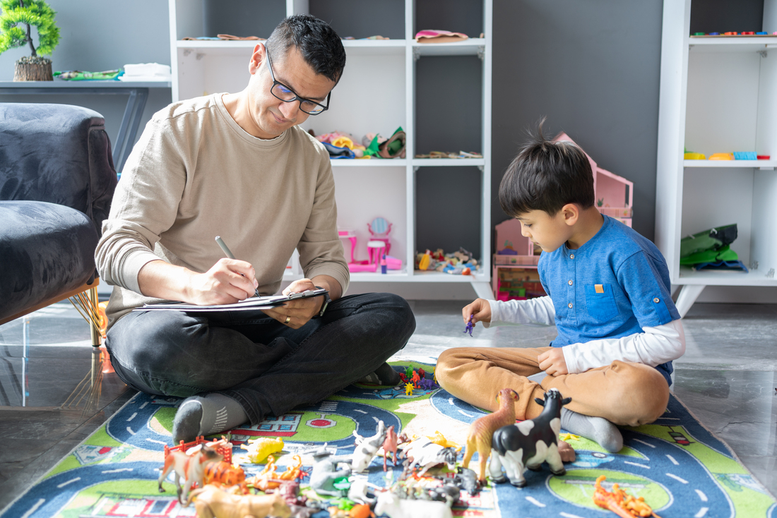 Child playing with toys in therapy room
