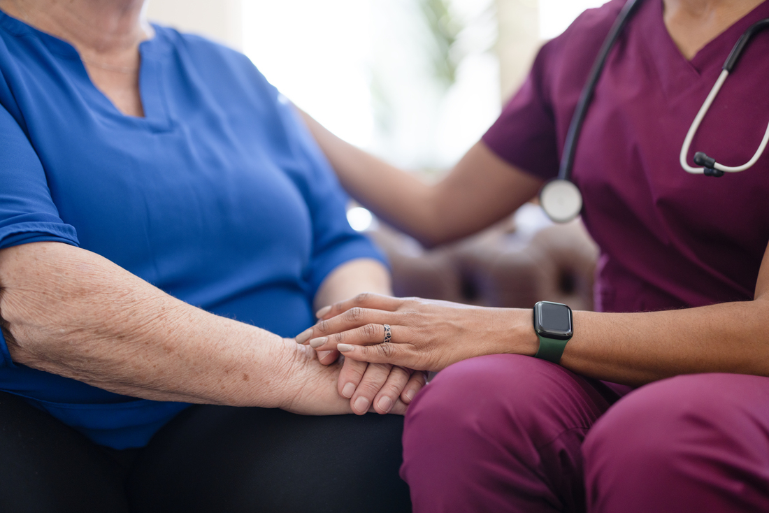 Healthcare worker comforting woman