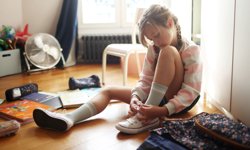 Child tying shoe.jpg