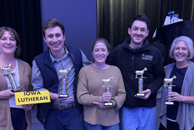 A group of residents, a faculty member and an alumni holding their trophies at Resident Jeopardy..jpg