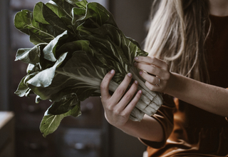 Woman holding swiss chard - week 37.jpg