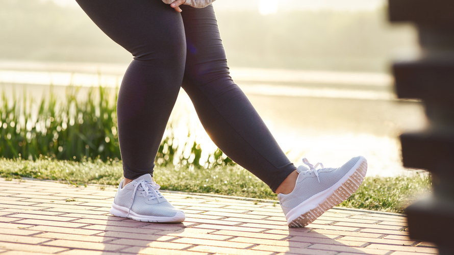 Doctor applying wrap to patient lymphedema legs.jpg