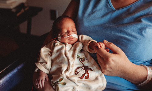 Mother holding preemie baby.jpg