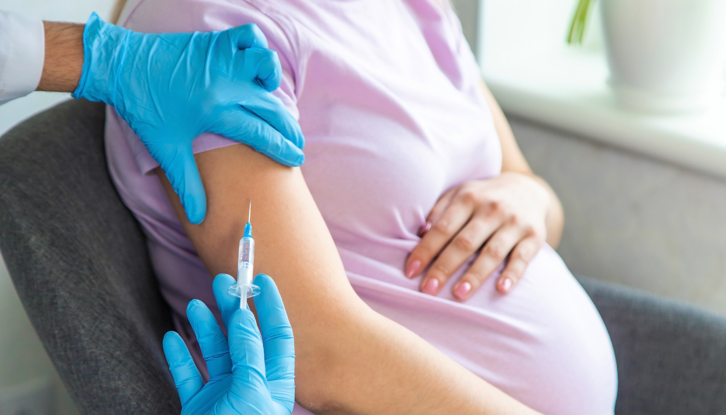 Pregnant woman getting vaccine