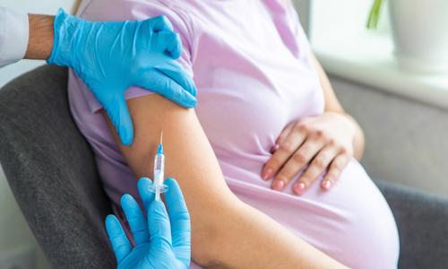 Pregnant woman getting vaccine