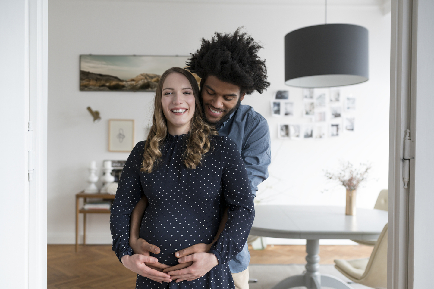 Pregnant woman with man hugging her.jpg
