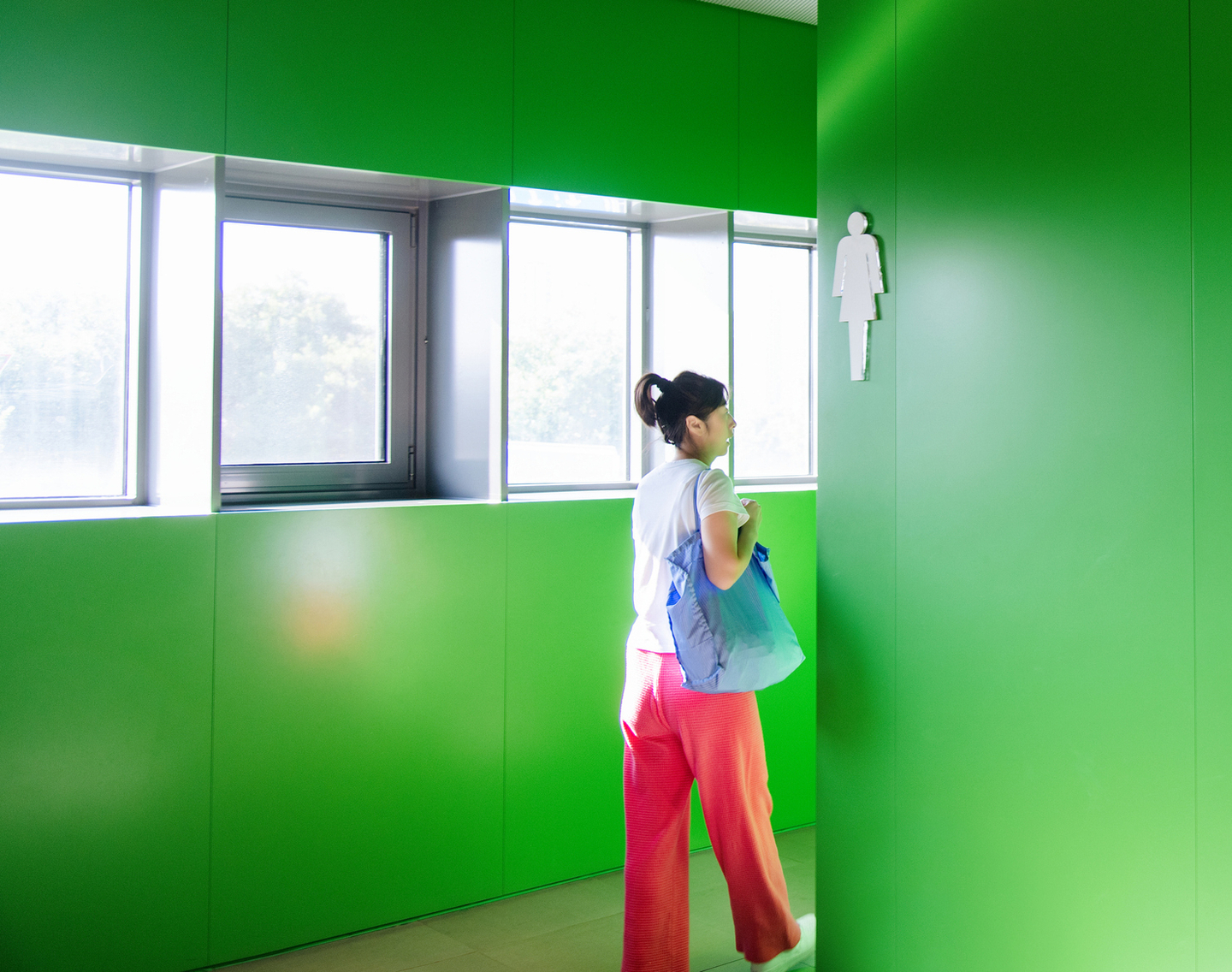 Woman entering bathroom.jpg