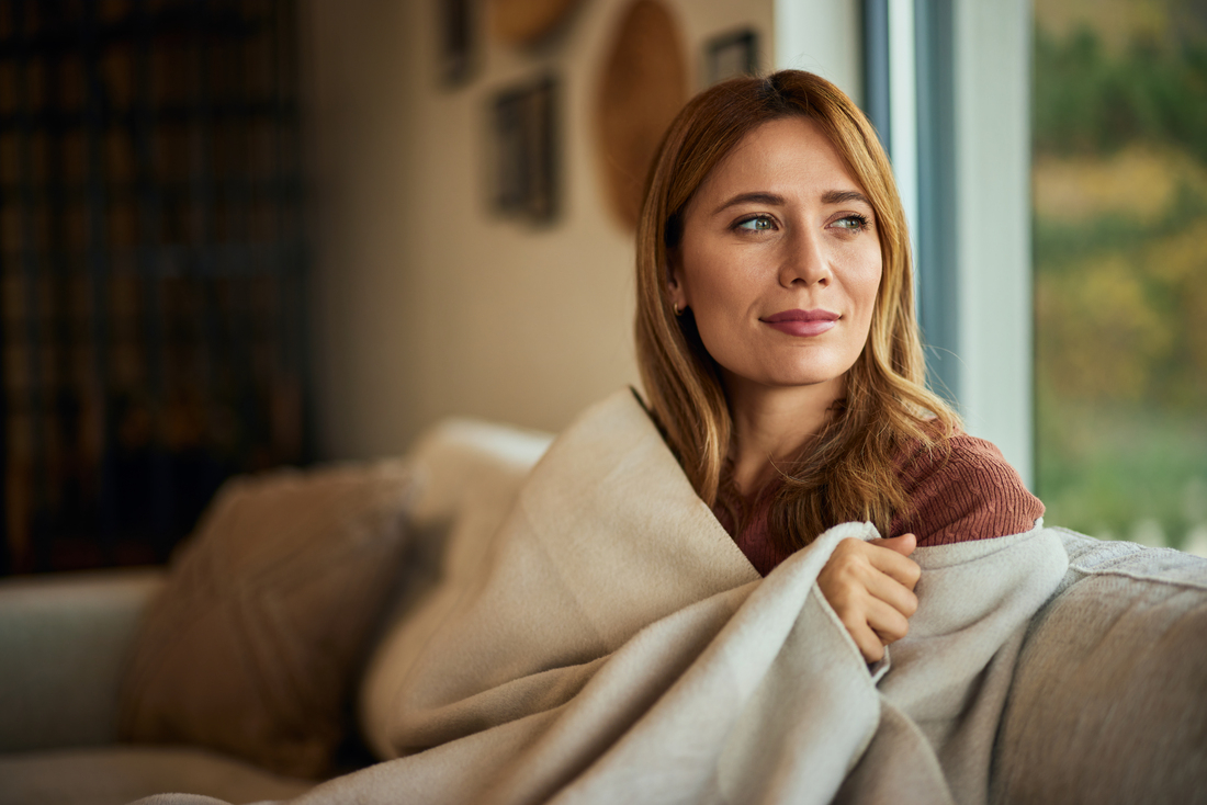 Woman sitting on Couch with Blanket.jpg