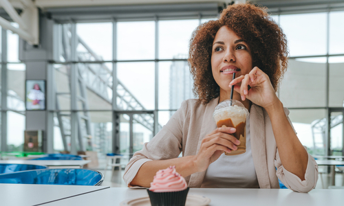 Woman sipping sugary drink.jpg